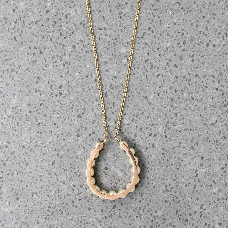 Fortuitous Pearl-Set Gold Horseshoe Pendant